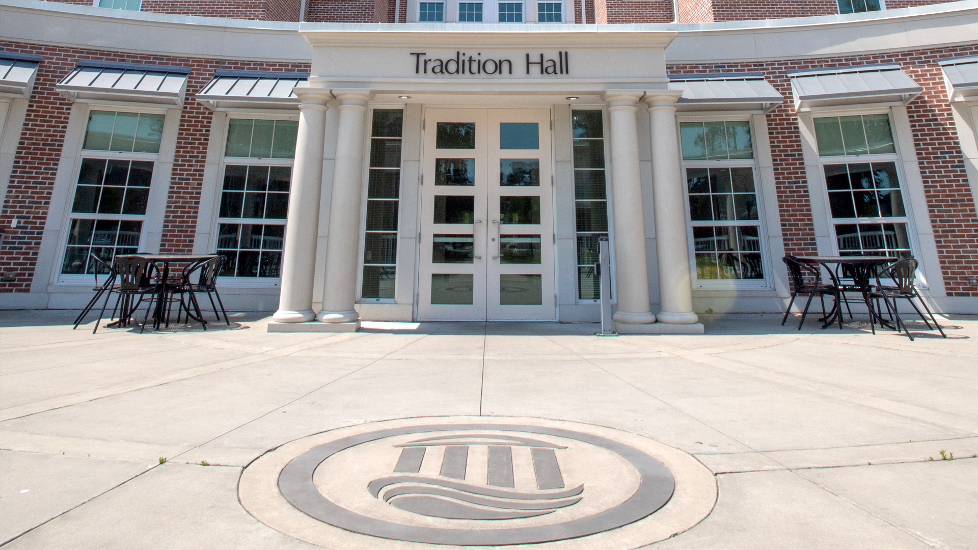 Atheneum Seal shown in front of Tradition Hall, and it is a tradition to not step on them.