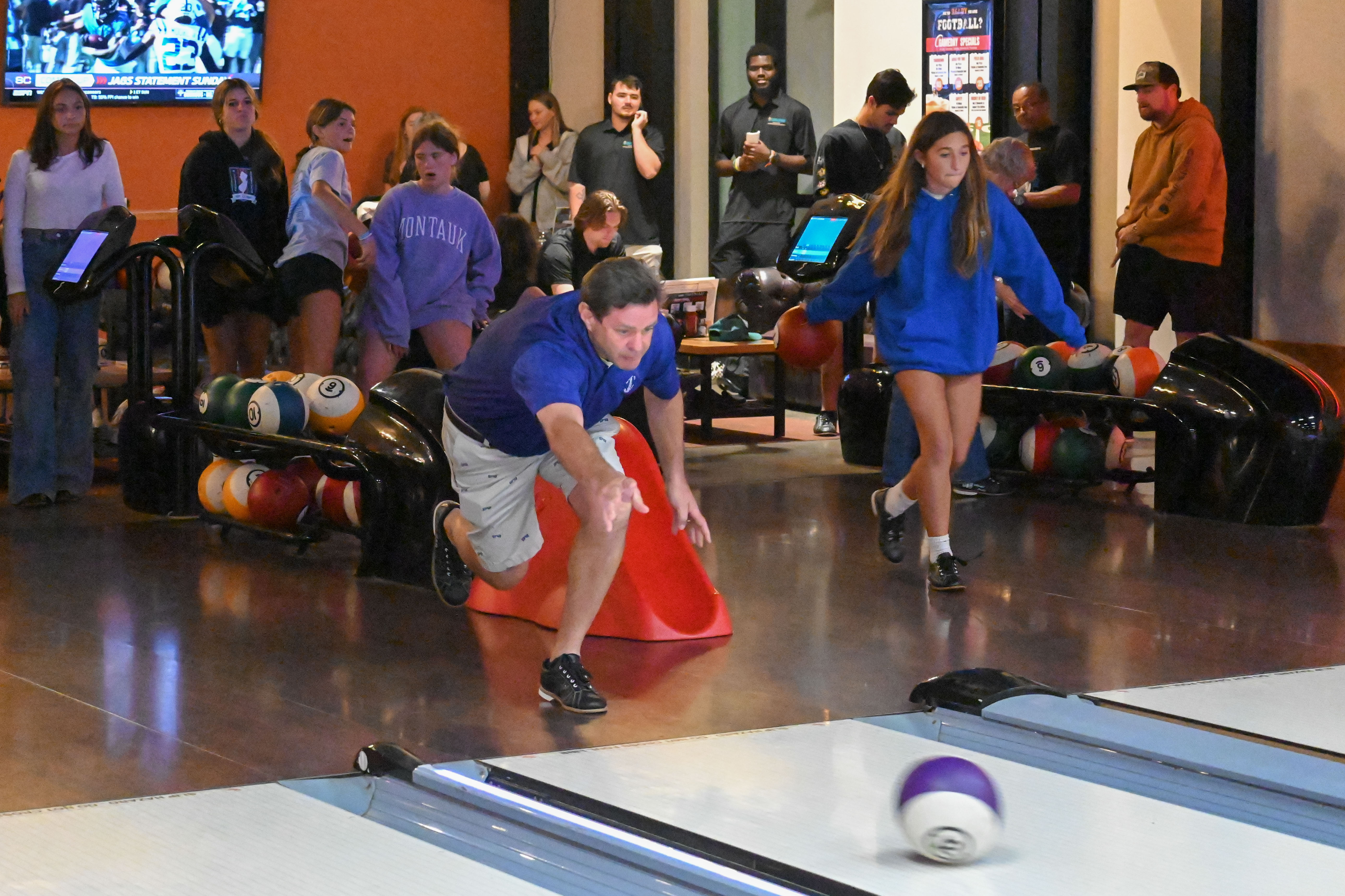 A photo of man bowling at CCU Strikes for Symposium event