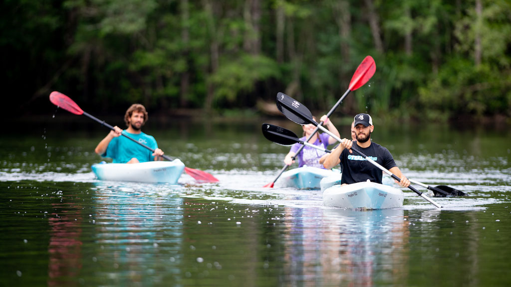 Group of CCU students kayaking on lake