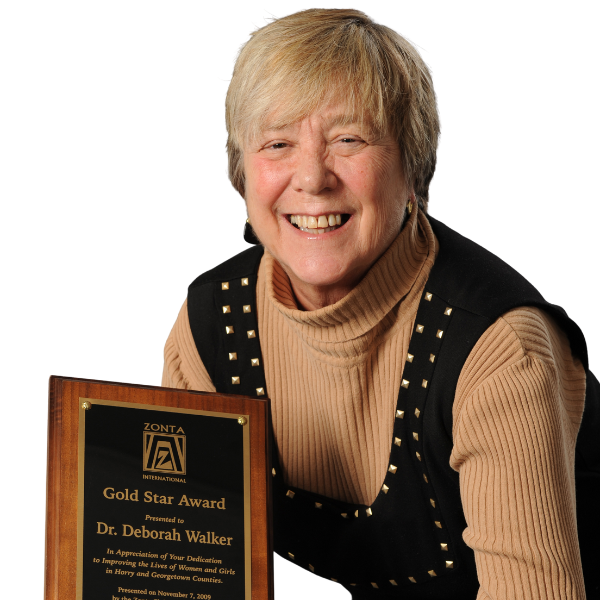 Headshot of Dr. Deborah Breed with award