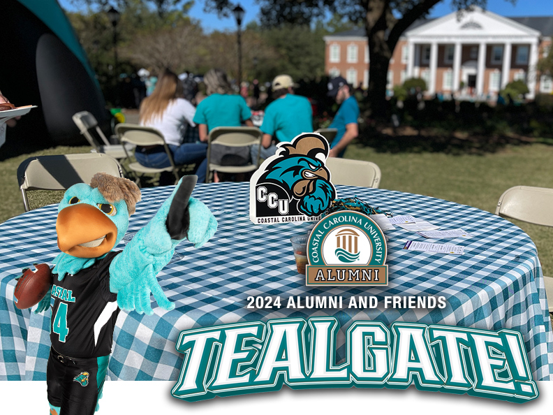 a photo of a table and alumni at TEALgate