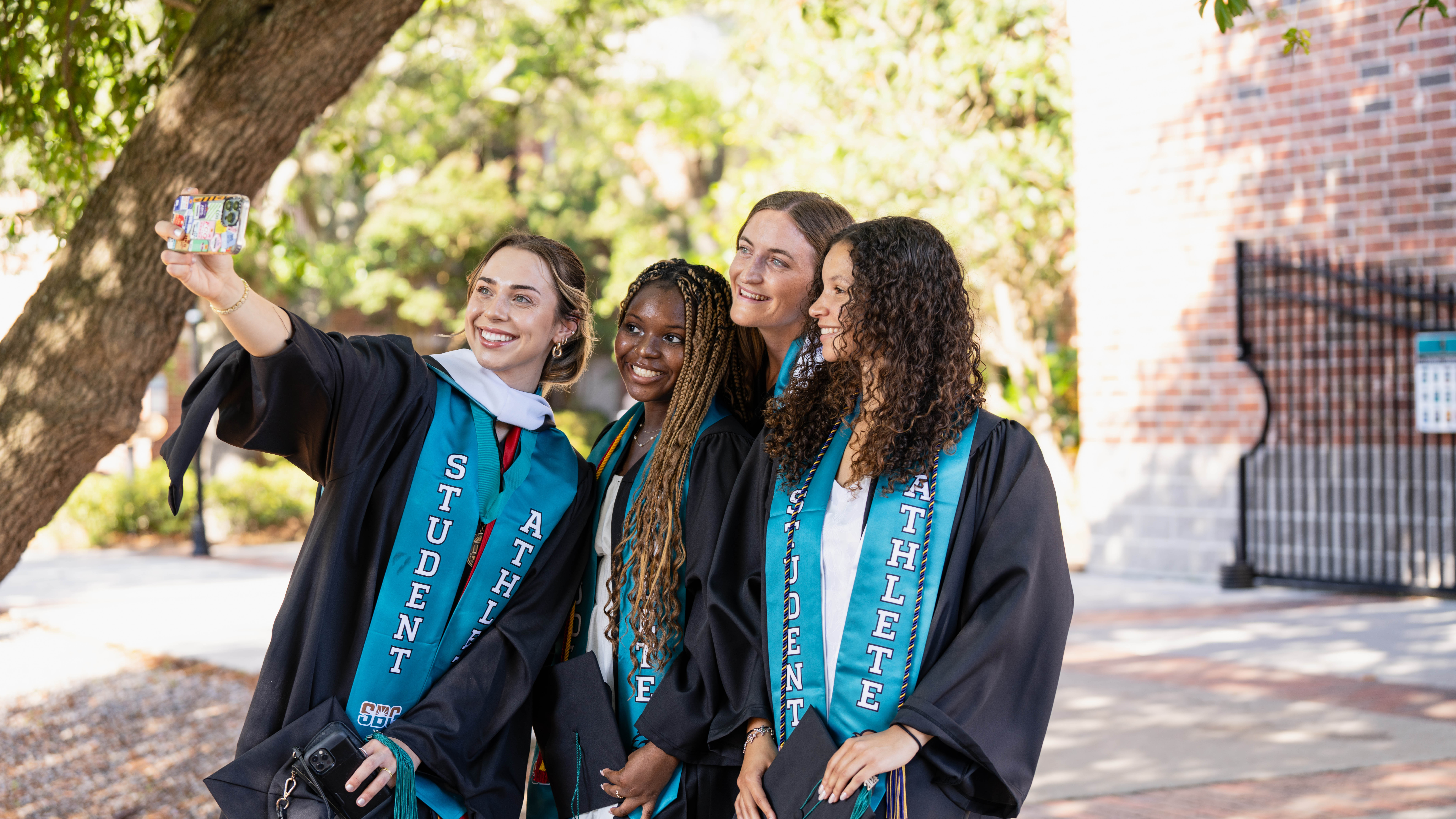 Four CCU Graduates Taking a selfie